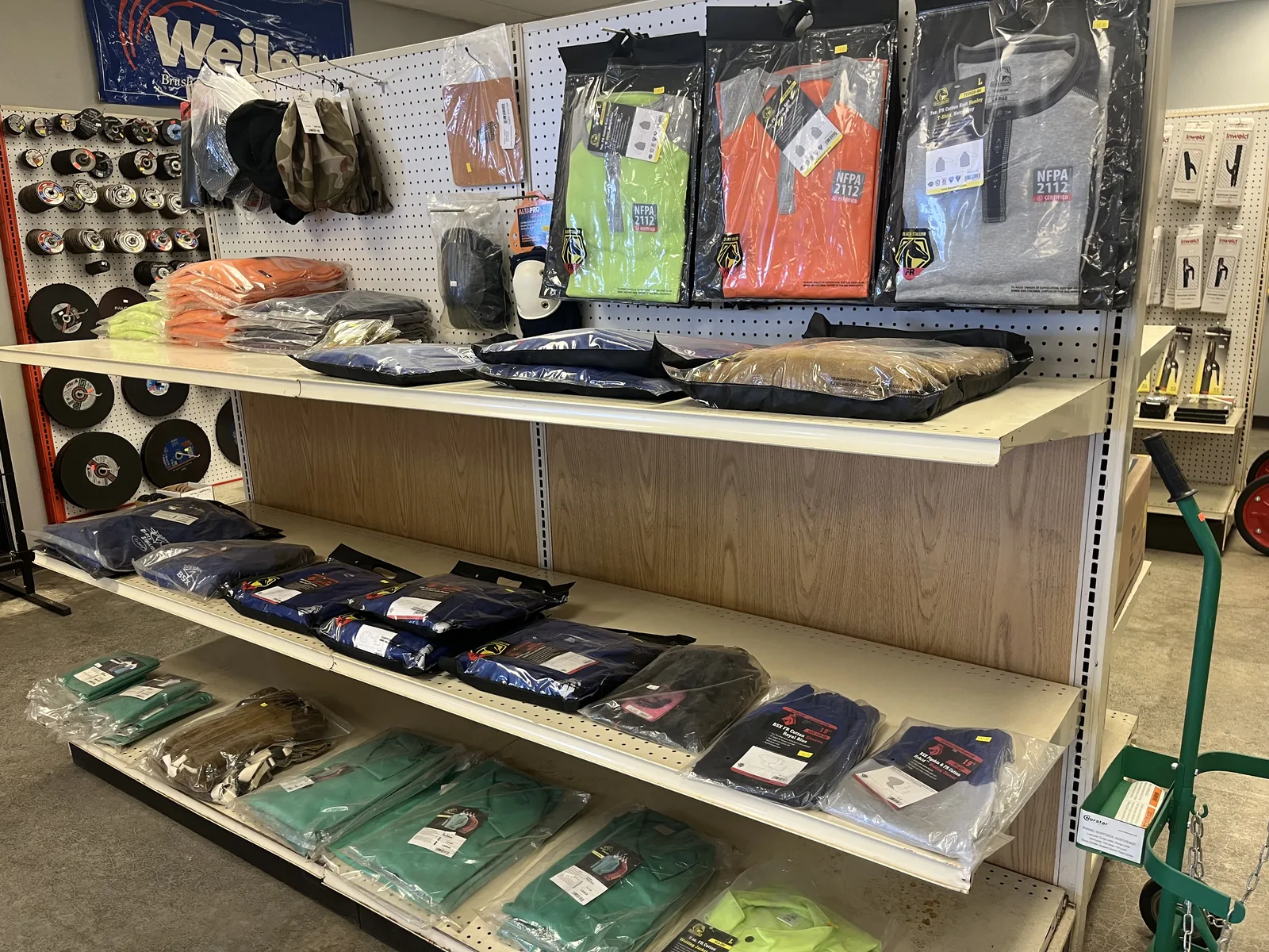 Shelf of gloves, coats and safety gear