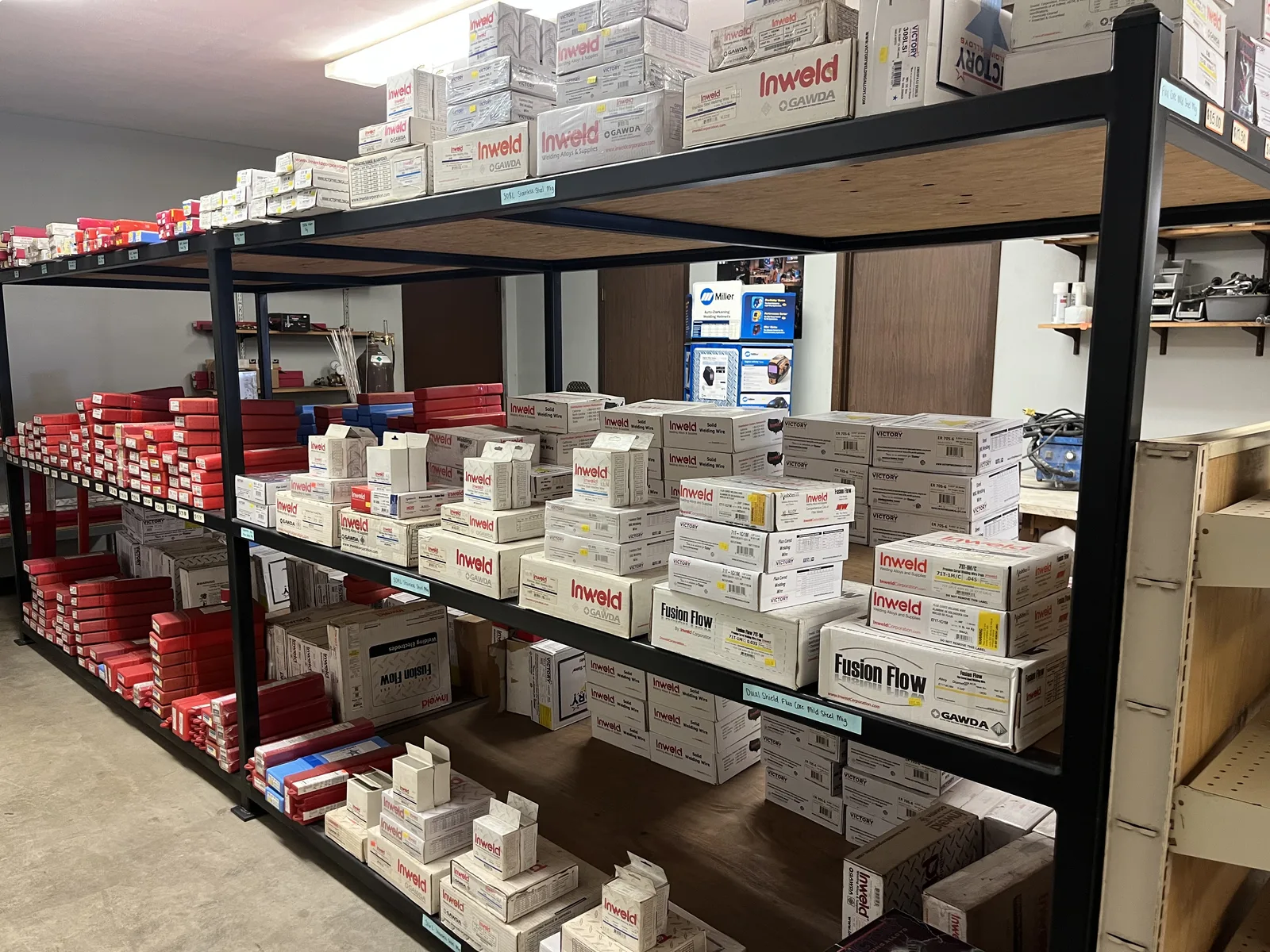 Shelf of MIG wire spools